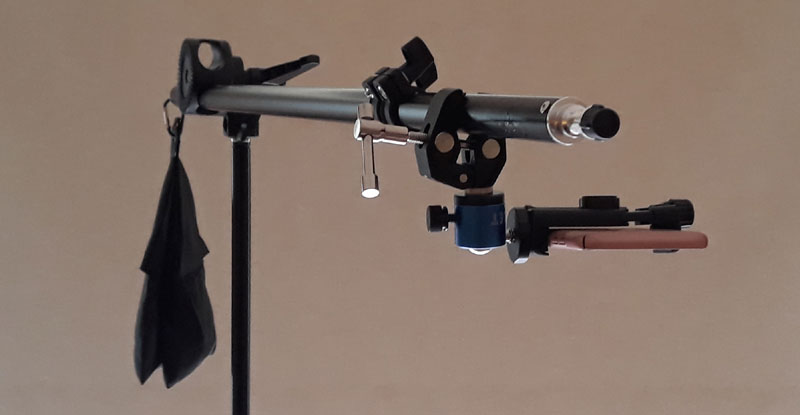 Using a light stand with a boom arm hold a phone above a piano keyboard